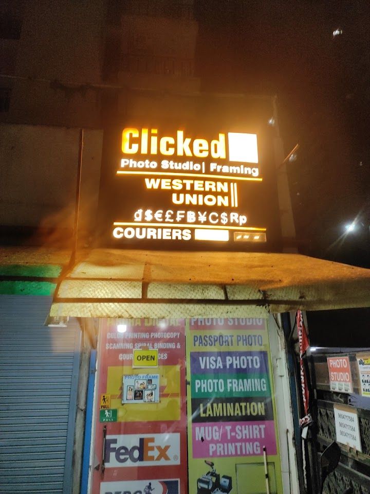 Clickedin Photo Studio & Framing